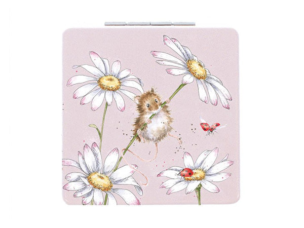 A pale pink pocket mirror with daisies and a mouse on the front in a watercolour style image.